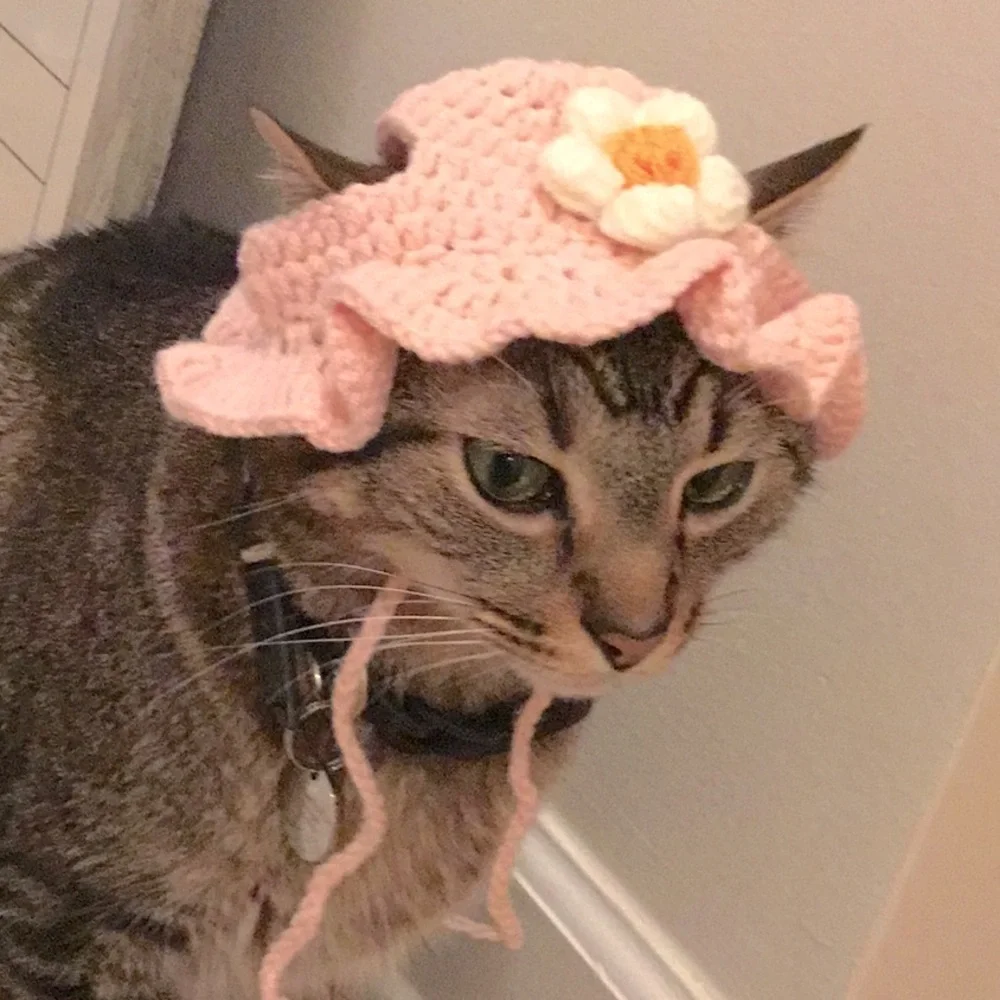 Pink Crochet bonnet with beautiful white flower.